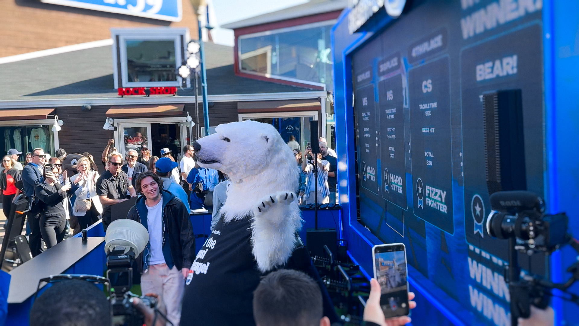 Pepsi interactive football game installation at Super Bowl LX brand activation, participants playing